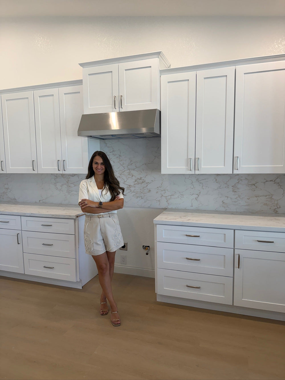 Goodyear AZ kitchen and bathroom remodel with custom white cabinetry, waterfall island and marble-look finishes
