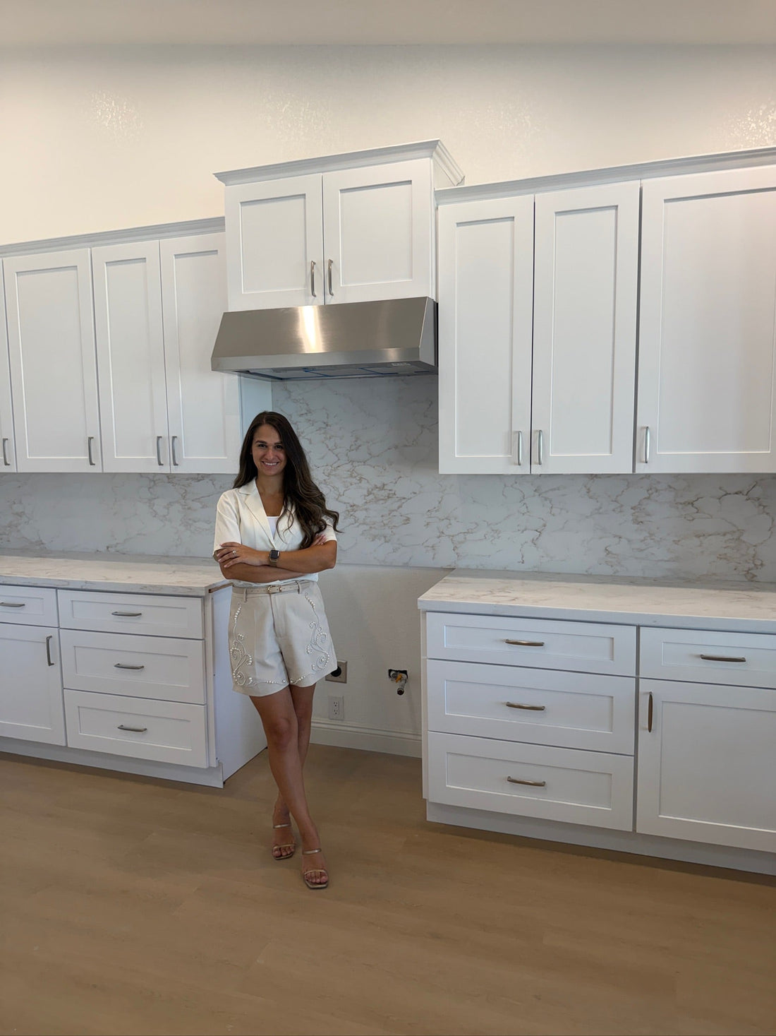 Goodyear AZ kitchen and bathroom remodel with custom white cabinetry, waterfall island and marble-look finishes