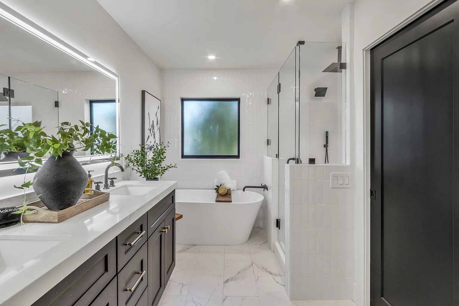 Modern bathroom remodel with walk-in shower, custom vanity and tile finishes in Phoenix AZ