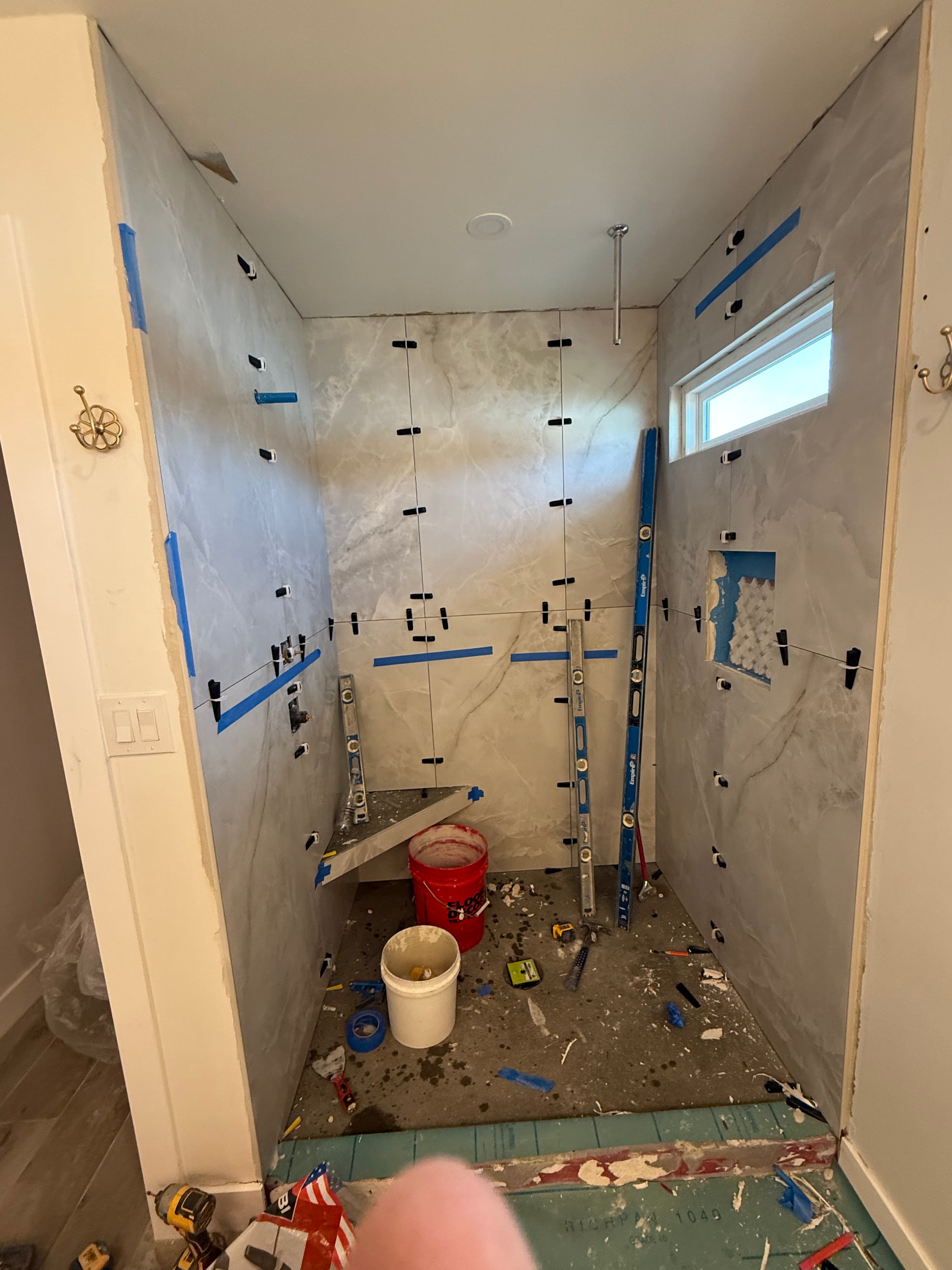 Waterproof shower bench and wall preparation during bathroom renovation